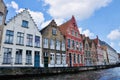 Bruges  Belgium - 16 06 2017 : colorful houses along the canal water passing through the medieval old town of Bruges Royalty Free Stock Photo