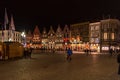 People on the large Market Square Markt in the centre of Bruges, night scene