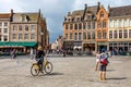 BRUGES, BELGIUM - JUNE 10, 2014: Cyclists in streets in Bruges Royalty Free Stock Photo