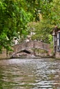 BRUGES, BELGIUM - JUNE 8, 2017: Group of tourists at an excursion on canal of the city Royalty Free Stock Photo