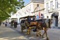 Horse drawn carriage touring visitors around Belgium\'s cobbled streets Royalty Free Stock Photo