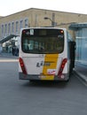 A bus (Van Hool) of De Lijn (company) is standing at a platform at Bruges station.