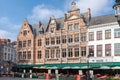 BRUGES, BELGIUM - MARCH 23, 2015. Tourists in north side of Grote Markt (Market Square) of Bruges, Brugge, with enchanting street Royalty Free Stock Photo