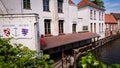 Bruges, Belgium - May 12, 2018: Empty Quayside Jetty For Pleasure Boats On The Canal And At Home Above Water