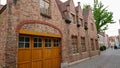 Bruges, Belgium - May 12, 2018: Roofs And Windows Of Old Authentic Brick Houses On Street Ontvangers-straat