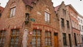 Bruges, Belgium - May 12, 2018: Roofs And Windows Of Old Authentic Brick Houses On Street Ontvangers-straat