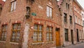 Bruges, Belgium - May 12, 2018: Roofs And Windows Of Old Authentic Brick Houses On Street Ontvangers-straat