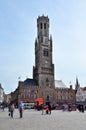 Bruges, Belgium - May 11, 2015: Tourist visit Belfry of Bruges on Grote Markt square. Royalty Free Stock Photo