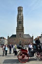 Bruges, Belgium - May 11, 2015: Tourist visit Belfry of Bruges on Grote Markt square Royalty Free Stock Photo