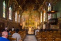 Bruges, Belgium - May 11, 2015: Tourist visit Interior of Basilica of the Holy Blood in Bruges. Royalty Free Stock Photo