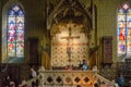 Bruges, Belgium - May 11, 2015: Tourists visit Interior of Basilica of the Holy Blood in Bruges Royalty Free Stock Photo