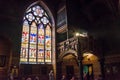 Bruges, Belgium - May 11, 2015: Tourists visit Interior of Basilica of the Holy Blood in Bruges Royalty Free Stock Photo