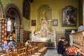 Bruges, Belgium - May 11, 2015: Tourists visit Interior of Basilica of the Holy Blood Royalty Free Stock Photo