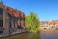 Tourists are waiting for free tourist boat. Beautiful canal and old, traditional houses in the town of Bruges Royalty Free Stock Photo
