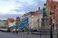 Brugge plastic whale near the monument of Jan van Eyck