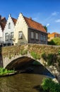 Bruges, Belgium vintage stone houses and bridge over canal Royalty Free Stock Photo