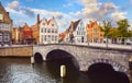 Bruges Belgium vintage stone houses and bridge over canal Royalty Free Stock Photo