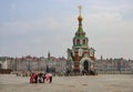 The Bruges embankment with a Christian chapel and girls with horses in Yoshkar-Ola, Russia