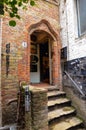 Bruges, flanders, Belgium. August 2019. The entrance to the historic de garre brewery. Six steps lead to the threshold: the red Royalty Free Stock Photo