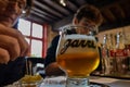 Bruges, flanders, Belgium. August 2019. Interior of the historic de garre brewery. A mug of fine craft beer was served with a few Royalty Free Stock Photo