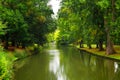 Bruges, Flanders, Belgium, Europe - October 1, 2019. Canal through Minnewater Park leading to lake of love in the medieval city of Royalty Free Stock Photo