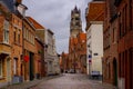 Bruges, Flanders, Belgium, Europe - October 1, 2019. Medieval ancient houses made of old bricks on ancient medieval street in Royalty Free Stock Photo