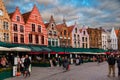 Bruges, Flanders, Belgium, Europe - October 1, 2019. Unknown people on the medieval ancient Market Place Market Square in