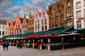 Bruges, Flanders, Belgium, Europe - October 1, 2019. Unknown people on the medieval ancient Market Place Market Square in