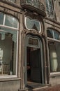 Front door of an Art Nouveau building in a street of Bruges.