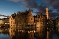 Bruges, West Flemish Region, Belgium - The historical Rozenhoedkaai reflecting in the canal