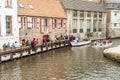 BRUGGE, BELGIUM - APRIL 22: Boat tour into the can Royalty Free Stock Photo