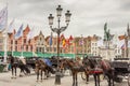BRUGGE, BELGIUM - APRIL 22:Horses and carriages in Royalty Free Stock Photo