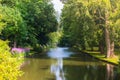 Brugge, Belgium. Green park in Bruges with water channel. Royalty Free Stock Photo