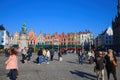 View on market square grote markt with cafes and restaurants with people and monument on warm sunny autumn day