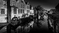 Black and White Photo of Medieval houses reflecting in the waters of a canal in Bruges, Belgium Royalty Free Stock Photo