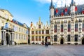 Historic buildings of the Brugse Vrije with the old Civil Registrar building on the right on the Burg Square in Bruges, Belgium