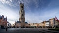 Sunrise over Market Square in the center of Bruges with the may Historic Buildings and the famous Belfry Tower Royalty Free Stock Photo