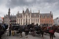 Brugge City Hall and horse carriages in autumn