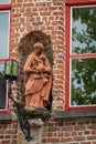 Red stone Madonna statue, Bruges, Belgium Royalty Free Stock Photo