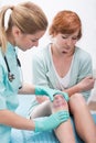 Bruised woman in doctor's office