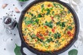 Brunch egg frittata with spinach, roasted red peppers, mushrooms, in cast iron, horizontal, top view Royalty Free Stock Photo