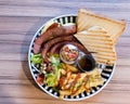 Brunch with german sausage, cereal, French fries and toast Royalty Free Stock Photo