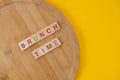 Brunch Menu Concept. Scrabble Letter Tiles On Wooden Table. Yellow Background