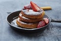 Brunch pancakes with berries, honey and powdered sugar Royalty Free Stock Photo