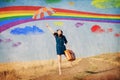 Girl fly away with umbrella and suitcase Royalty Free Stock Photo