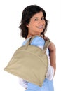 Brunette all smiles with handbag Royalty Free Stock Photo