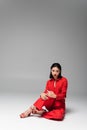 brunette asian model in red jacket Royalty Free Stock Photo