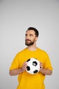 brunette bearded football fan in yellow Royalty Free Stock Photo