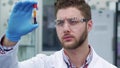 Man holds test-tube in his hand at the laboratory Royalty Free Stock Photo