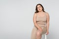 Brunette body positive woman sitting on